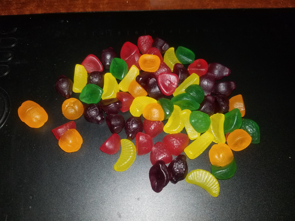 A weird photo of a pile of Rowntree Fruit Gums. Tiktok would describe it as cursed.